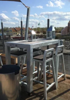 Barbord i galvaniseret jern med betonfliser og hjul